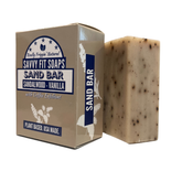 A box of Savvy Fit Soaps Sand Bar in Sandalwood Vanilla with an open soap, highlighting its plant-based, USA-made, and soothing skincare formula.